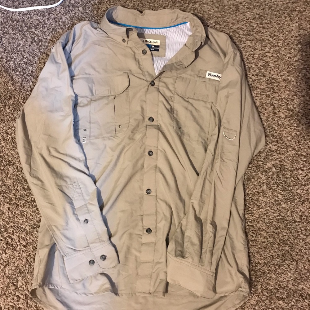 Tan fishing shirt.